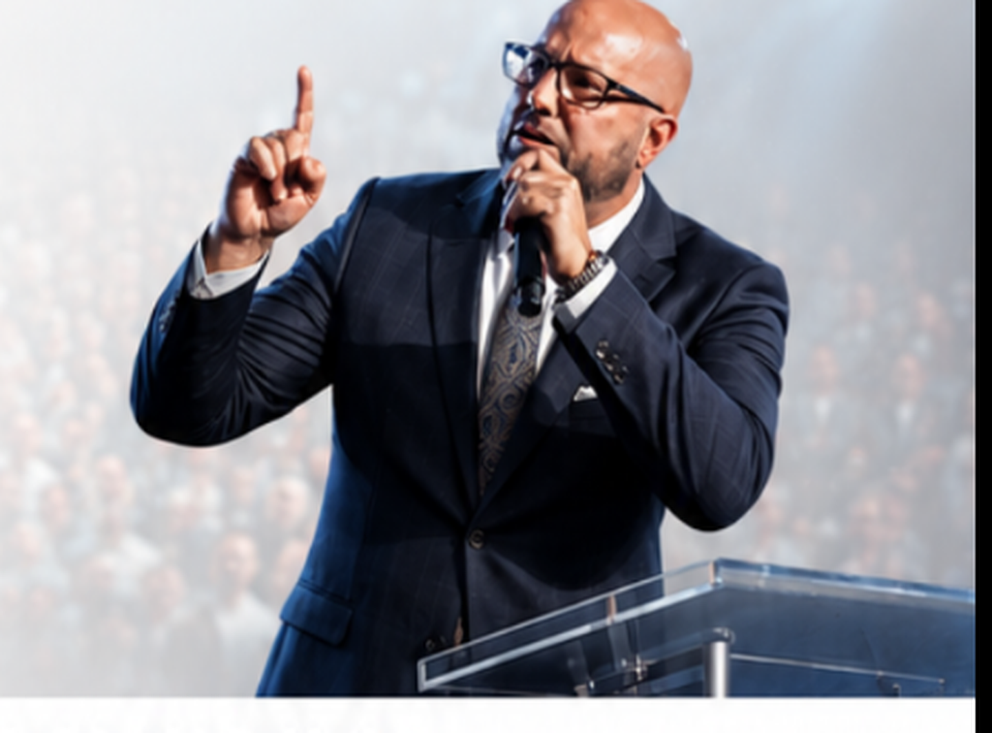 Evangelist speaking at a podium